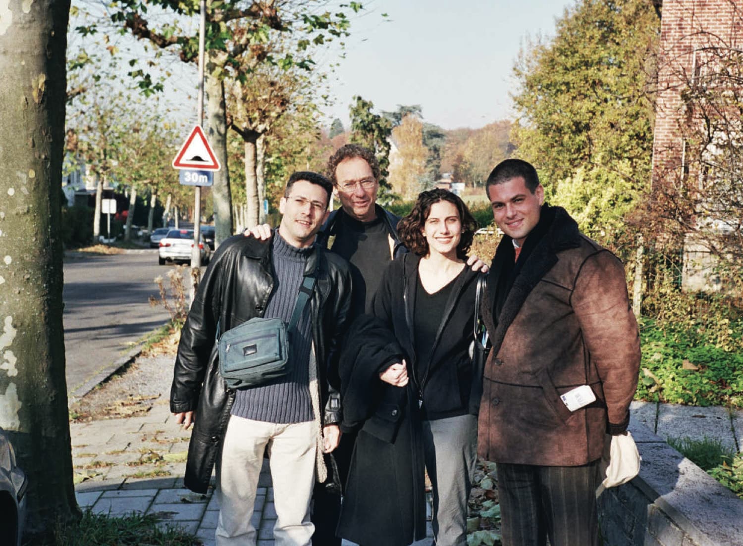 Joey Low with three young Israeli delegates on a tree-lined street in Brussels.