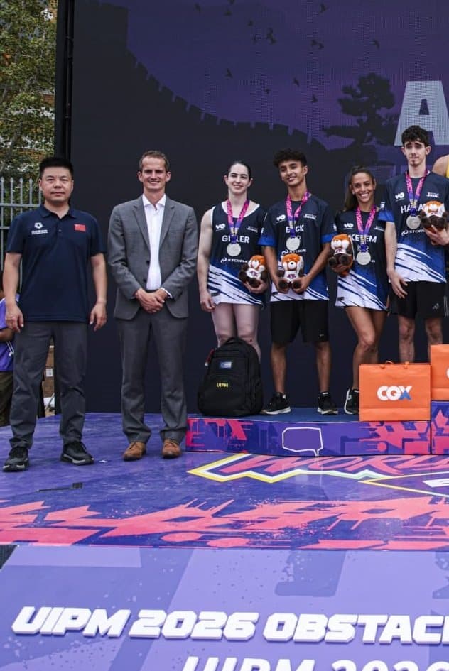 Nevo Beck and Team Israel on the podium with their silver medals at the World Obstacle Championship in Beijing.