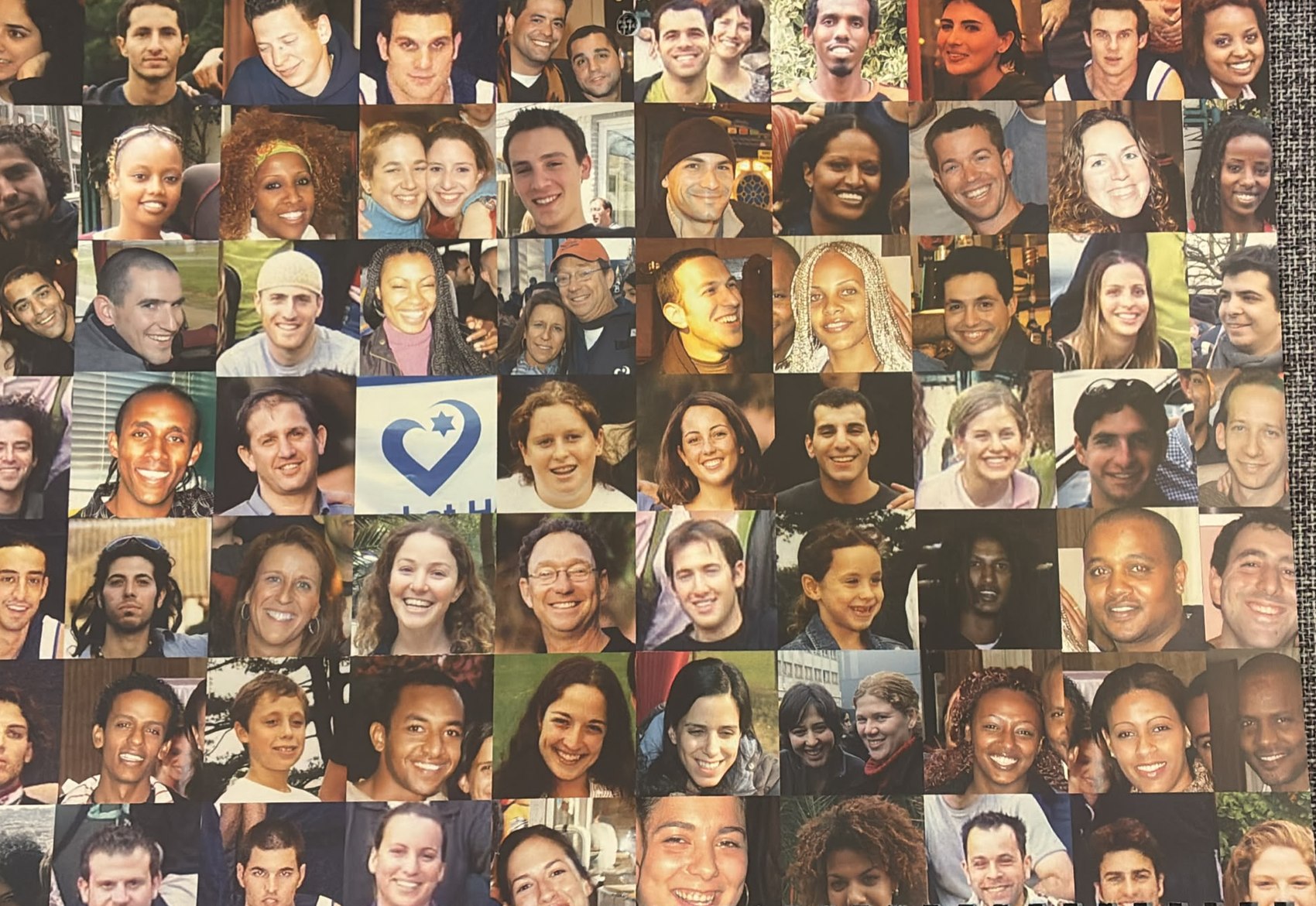 A grid of portrait photographs of Israel at Heart participants gathered around the organization's heart logo.