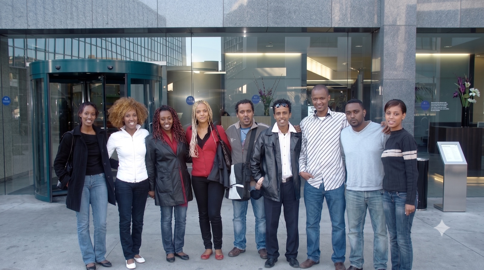 Nine Ethiopian-Israeli delegates standing together outside a building during the United States tour.